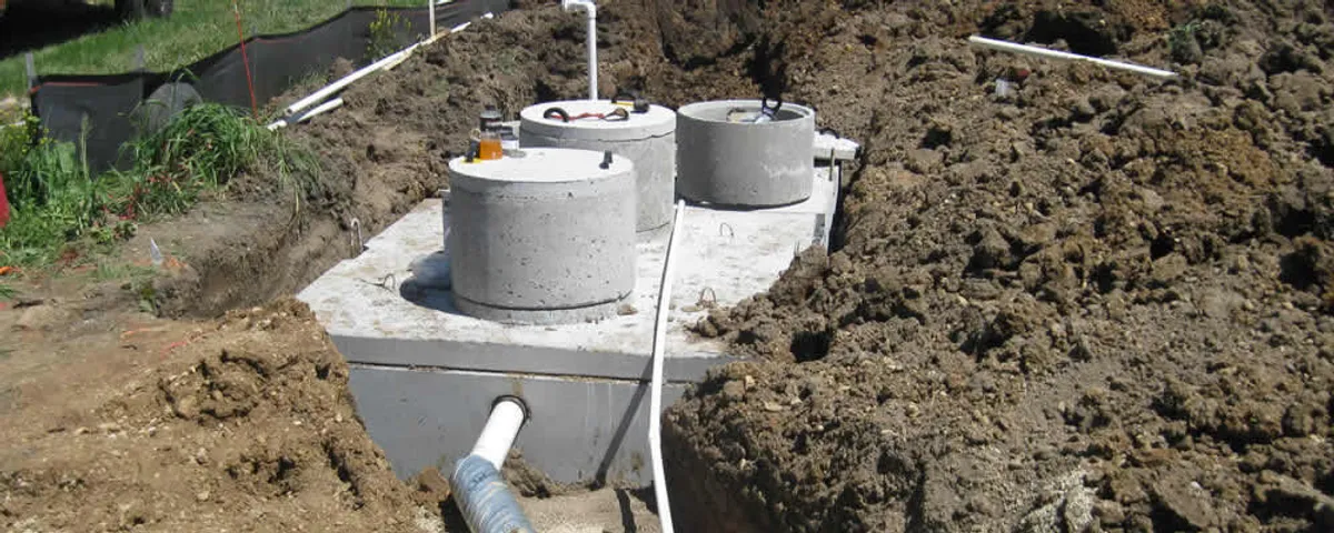 Septic system repair and installation site with tank access ports in Chicago, IL