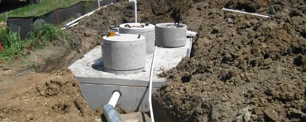 Septic system repair and installation site with tank access ports in Chicago, IL