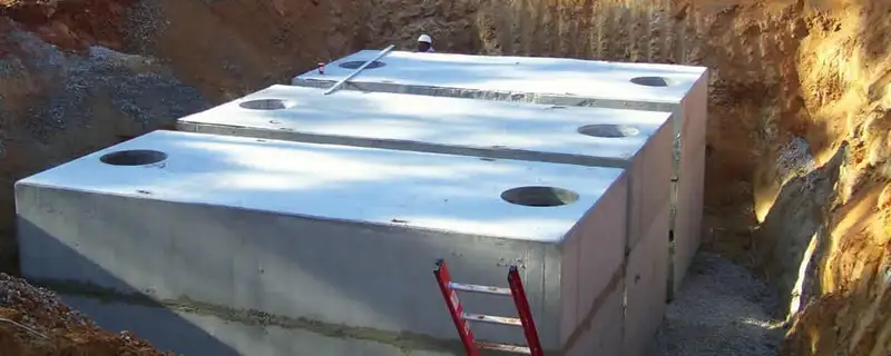 Septic tank installation site with a newly placed concrete tank in Chicago, IL